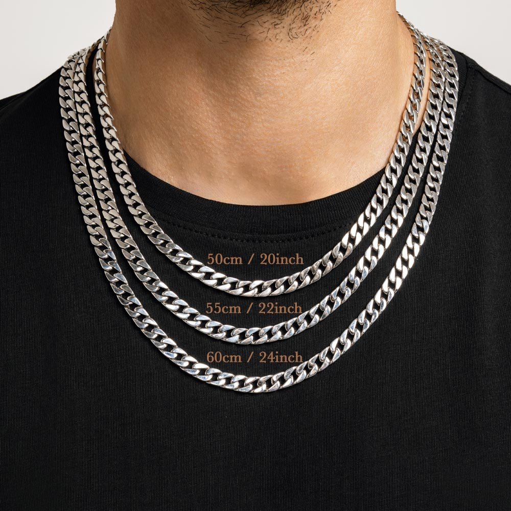 Man in a black T-shirt wearing three Ronatelli Cana 7 mm curb chains at once, labeled 50 cm / 20 inch, 55 cm / 22 inch, and 60 cm / 24 inch, each hanging lower than the last