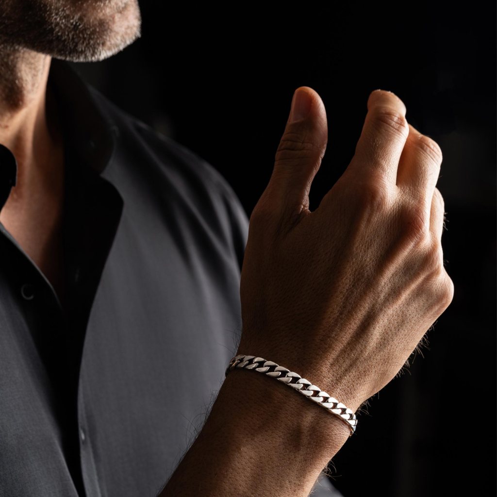 Man in a dark shirt wearing the Ronatelli Cana Cuban link 925 sterling silver bracelet