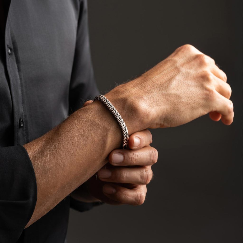 Man in a dark shirt wearing the Ronatelli Crein foxtail 925 sterling silver bracelet