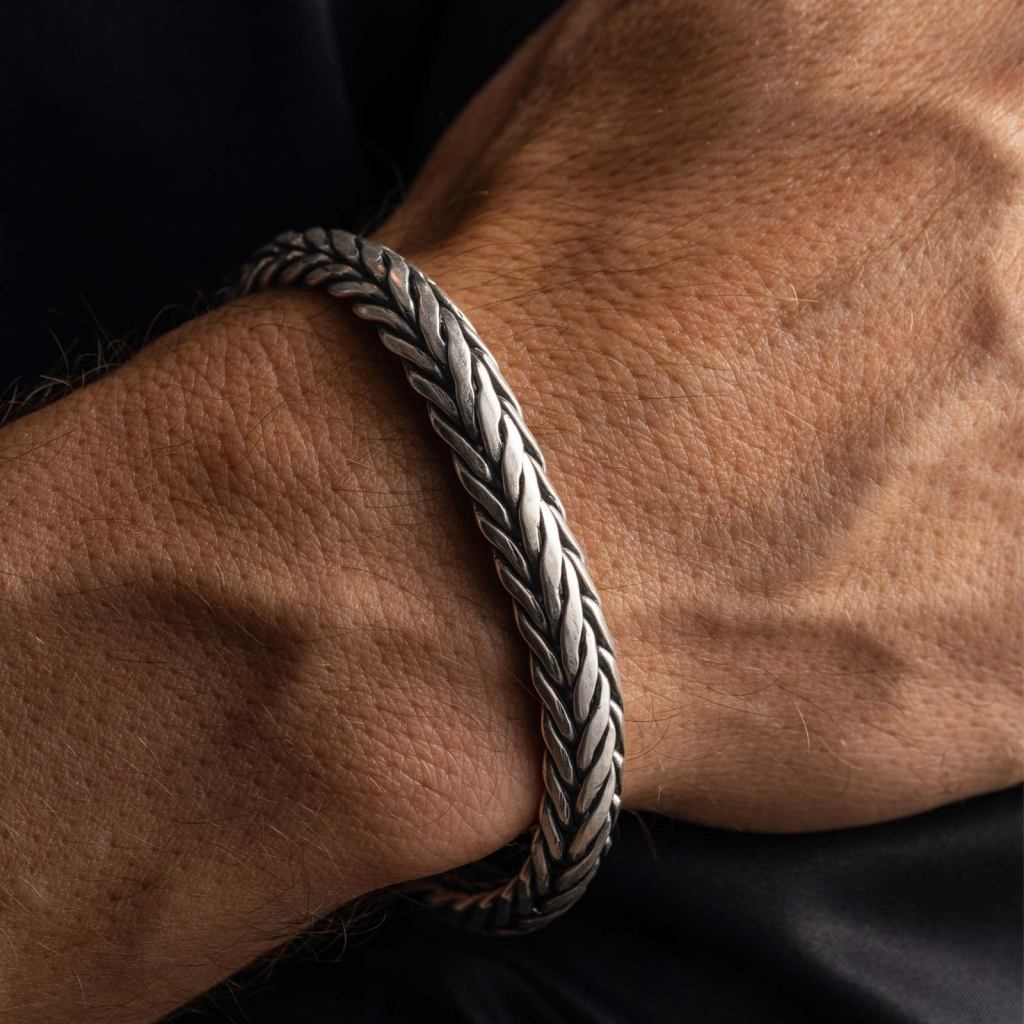 Man wearing the Ronatelli Lesi heavy braided 925 sterling silver bracelet on his wrist