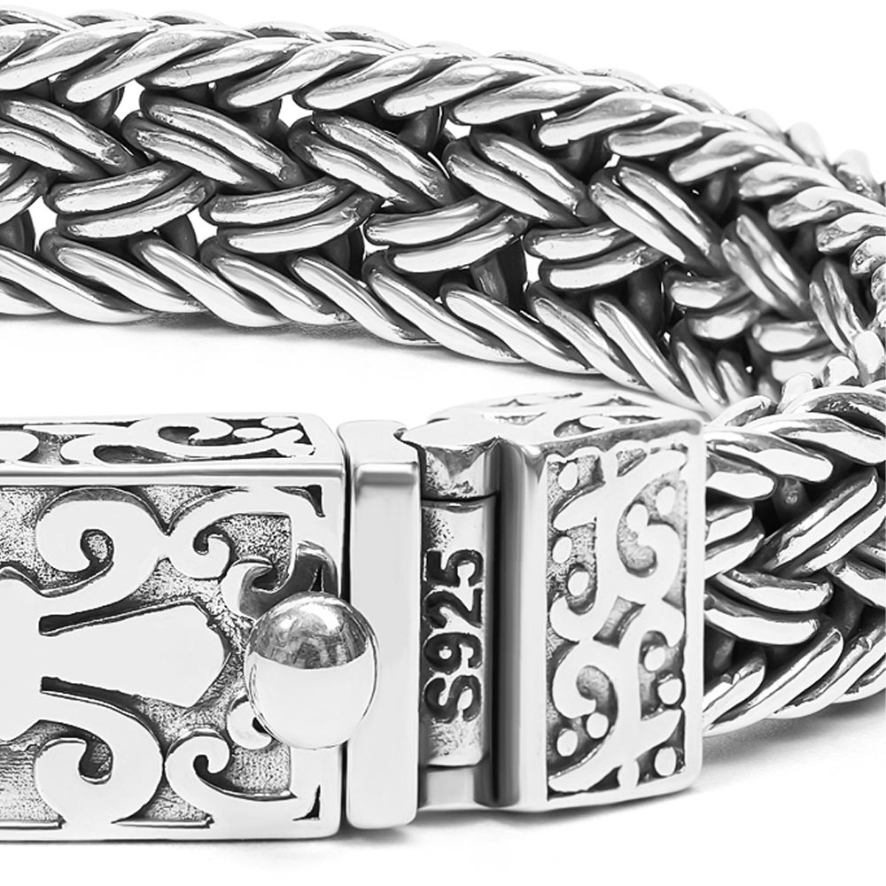 Close-up of the Ronatelli Marlo wide woven sterling silver bracelet showing the braided links, the openwork clasp, and the S925 stamp