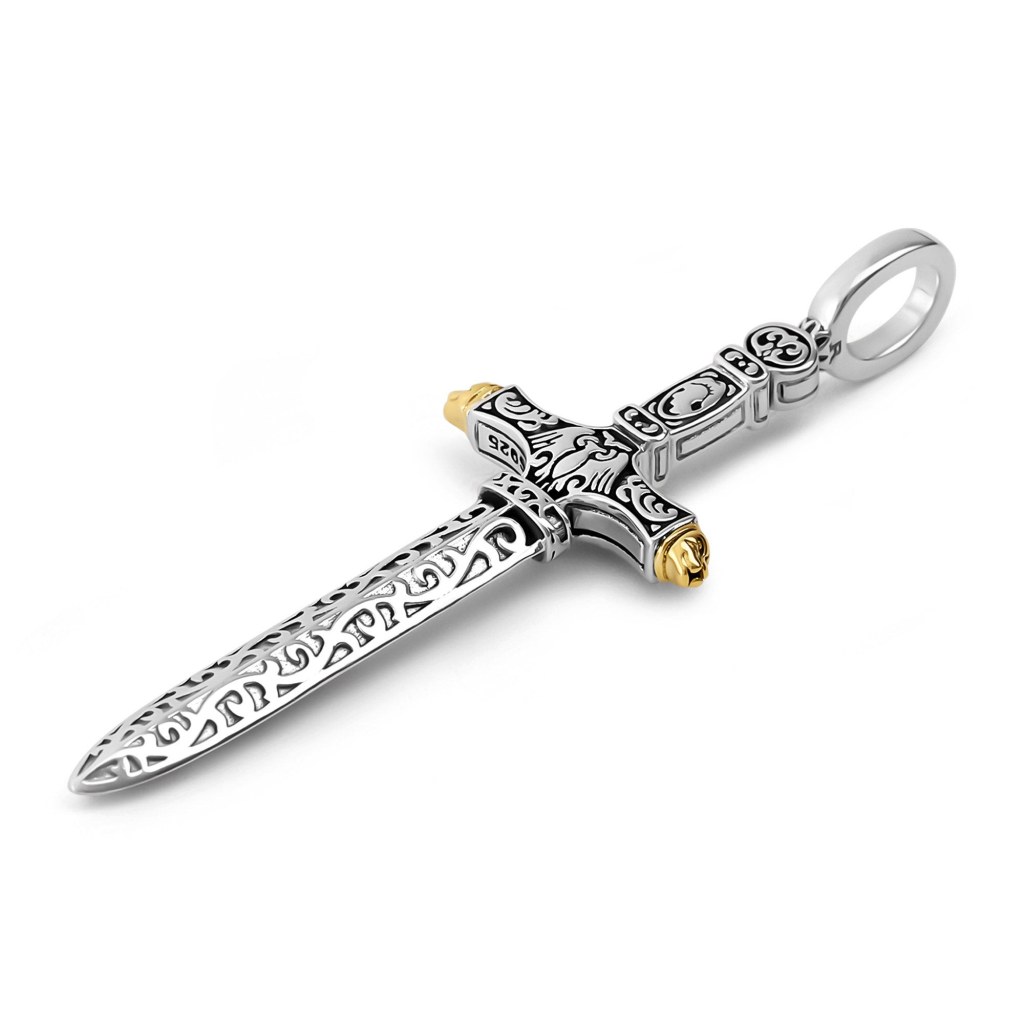 The Ronatelli Ravenna cross sword 925 sterling silver pendant at an angle, showing the scrollwork along the blade and the gold-tone tips of the crossguard