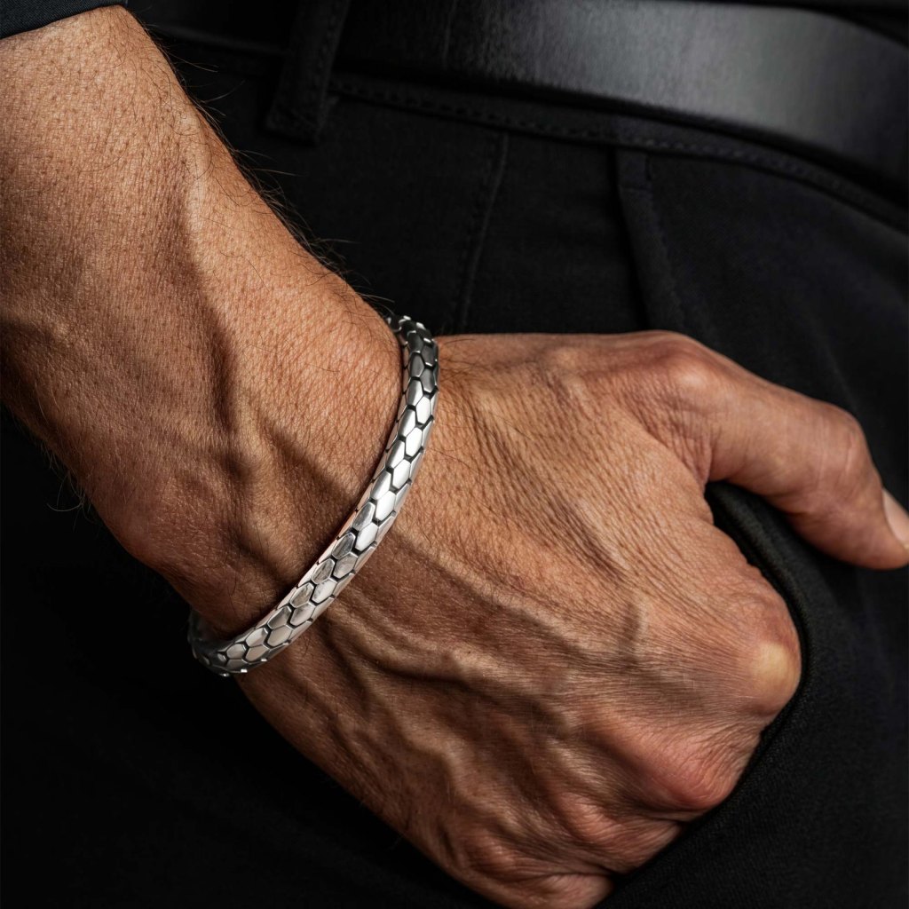 Man with his hand in his pocket wearing the Ronatelli Roma 8 mm snake-scale 925 sterling silver bracelet